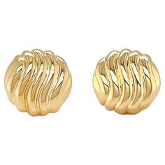 Timeless monochromatic gold earrings are given a glamorous update. A round 18k yellow gold base features rows of raised lines that curve in soft waves. The waves are polished and reflect the light and shadows that are cast on them. Clip-backs secure the earrings, which measure 0.5 inches (width) by 0.5 inches (length) by 0.2 inches (depth). Wavy Pattern, Soft Waves, Jewelry Earrings Studs, Gold Earrings, Jewelry Earrings, Stud Earrings, Yellow Gold, Thing 1, Yellow