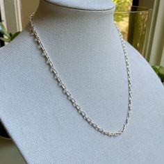 Are you looking for a timeless statement necklace for someone special? Do you need a sturdy sterling silver chain for a special pendant? This simple yet elegant handcrafted oval chain will last forever and would make the perfect gift. And it costs a fraction of silver chains that come in a blue box and a bow! Here are the details: This beautiful necklace starts off as sterling silver wire and a clasp and was transformed into a tiny oval link chain...each link measuring about 3mm x 6mm and the completed length is about 21 inches long. All of the links were individually formed, cut and soldered - which is tricky with links this small! This item was handmade by Will Macy in Corvallis, OR. This item is ready to ship. If you need a different length, please message us and we can make any length Sterling Silver Chain Necklace With Oval Links, Sterling Silver Oval Link Necklace For Everyday Wear, Sterling Silver Oval Link Necklace, Silver Oval Pendant Chain Jewelry, Silver Sterling Rolo Chain Necklace, Minimalist Silver Necklace With Oval Link, Minimalist Silver Oval Link Necklace, Silver Rolo Chain Necklace For Everyday, Everyday Silver Necklace With Rolo Chain