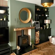 a living room filled with furniture and a fire place next to a wall mounted tv