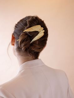 The pièce de résistance of the season, we bring you the Genevieve Hair Pin. Twist into any updo for the most artistic stunning scene imaginable. This pin can hold tons of hair and can slide into any hairstyle. 14K Gold Plated. Measures: 5.25" in height, 2.75" in width Made in NYC. Modern Hair Styles, Epona Valley, Modern Updo, Luxury Hair Accessories, Guest Hair, Gold Hair Pin, Bridal Handbags, Crown Headband, Luxury Hair