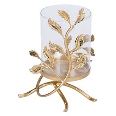 a gold leaf candle holder on a white background with an empty glass in the middle