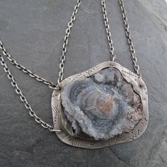 "Large Druzy Pendant Chalcedony Rose Necklace Sparkling Raw Gemstone Neckpiece: This is a stunning, one-of-a-kind neckpiece featuring a natural, raw, sparkling Chalcedony \"rose\" also known as \"Desert Rose\", is hand set on a stamped backplate and suspended from a sterling silver chain that's approximately 18 3/4\" in length. The stone is a sparkly gray with hints of pale blue and cream. Pendant measures approximately 1 1/2\" by 1 3/4\". All handmade in my little home studio. Enter my shop: ht Bohemian Silver Necklace With Large Stone, Unique Round Necklace With Large Stone, Bohemian Pendant Jewelry For Anniversary, Anniversary Necklace With Large Round Stone Pendant, Anniversary Necklace With Large Round Pendant Stone, Anniversary Necklace With Large Round Stone, Anniversary Necklace With Large Stone, Anniversary Necklace With Large Round Pendant, Anniversary Round Pendant Necklace With Large Stone