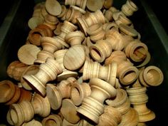 a pile of wooden knobs sitting next to each other