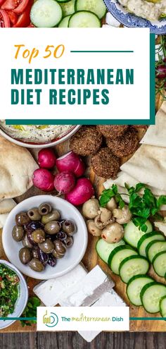 the top 50 mediterranean diet recipes are displayed on a table with cucumbers, olives and pita bread