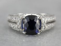 an oval shaped blue sapphire and diamond ring