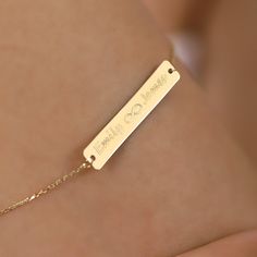 D E S C R I P T I O N Make every moment special with our 14K Solid Gold Engraved Bar Personalized Bracelet, a heartfelt and timeless piece that speaks volumes. Surprise your loved ones with this exquisite bracelet, crafted with precision and personalized just for them. The delicate bar design, available in Yellow gold, Rose gold, or White gold, allows you to add a name, date, or special message, making it a cherished keepsake that complements any style. P R O D U C T ∙ F E A T U R E S * Gold mat 14k White Gold Promise Bracelets, White Gold 14k Promise Bracelets, White Gold 14k Promise Bracelet, Personalized Yellow Gold Bracelet For Promise, Personalized Yellow Gold Promise Bracelet, Elegant Bracelet With Engraving Option For Gift, Elegant Bracelet With Engraving Option, Elegant Sterling Silver Name Bracelet With Engraving Option, Rose Gold Engraved Gold Bracelet For Wedding