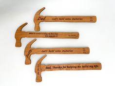 four wooden hammers with the words dad, let's build some memories and dad thanks for helping me build my life