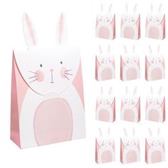 a bunch of pink bags with bunny ears on them and one bag in the shape of a rabbit