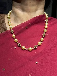 22 karat gold necklace with culture pearls 
     - 235-GN2220 - in 31.200 Grams for USD $2,139.35 USD. 
Made in India by Totaram Jewelers Online this product is in Gold - 22 Karat BIS Hallmark 916 Gold  & is an excellent gift for Adult - Women. Ships fully insured with secured guaranteed delivery for free with your order over $250 from New Jersey USA & comes with 30 days exchange policy. Elegant Gold Plated Pearl Necklace For Festivals, 22k Gold Pearl Necklace For Celebrations And Festivals, Bollywood Style Kundan Pearl Necklace, Festive Gold Kundan Necklace With Pearl Pendant, Gold Plated Temple Jewelry Pearl Necklace For Celebration, Gold Plated Pearl Necklace For Celebrations, Temple Jewelry Style, Gold Pearl Necklace With Pendant For Festivals, Festive Gold Pearl Necklace With Pearl Pendant, Gold Pearl Pendant Necklace For Celebrations