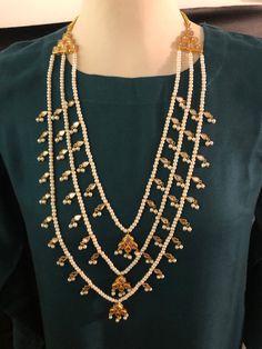 Three layers high quality kundan mala with white pearls. Hand crafted and gold plated Done n stock and ready to ship. Pearl Kundan Necklace With Tilla For Gift, White Kundan Necklace With Pearl Drop For Festivals, Bollywood Style White Kundan Necklace With Pearl Drop, Diwali Gift Kundan Necklace With Pearl Chain, Temple Necklace With Pearl Chain As Diwali Gift, Elegant Gold Pearl Necklace With Latkans, Long Pearl Necklace For Wedding And Festivals, Kundan Pearl Chain Necklace As A Gift, Kundan Pearl Necklace As A Gift