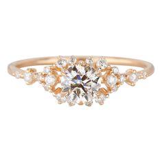 a gold ring with an oval cut diamond surrounded by small round diamonds on the band