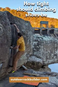 a man climbing up the side of a cliff with text overlay that reads how tight should climbing shoes be?