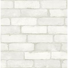 a white brick wallpaper with grey and white bricks on the bottom half of it