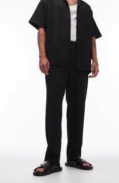 Textural rib lends depth to these edgy wide-leg trousers topped by a comfy elastic waist. 26 1/2" inseam; 14" leg opening; 13" front rise; 17 1/2" back rise (size Medium) Elastic waist Front slant pockets; back welt pockets 94% polyester, 6% elastane Machine wash, line dry Made in Turkey Ribbed Wide Leg Pants, School Wear, Maternity Shops, Designer Clothes For Men, Denim Jumpsuit, Women's Summer Fashion, Black Fits, Athletic Women, Wide Leg Trousers