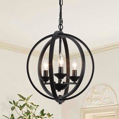 Crafted from durable metal, this hanging chandelier features a unique spherical ring shade that measures 14.96” W x 16.92” H, adding an industrial-inspired elegance to both modern and classic interiors. Simple Chandelier Entryway, Black Chandelier Entryway, Small Black Chandelier, Black Chandelier Dining Room, Iron Light Fixtures, Wrought Iron Light Fixtures, Chandelier Entryway, Simple Chandelier, Entryway Chandelier