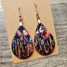 This pair of lightweight, teardrop earrings adds a unique touch, featuring original neuro-inspired artwork, "Decoding Hope". They are artsy, vibrant and a creative way to advocate for healthy thought patterns. A unique accessory for anyone needing a gentle reminder, but also eye-catching jewelry for those in neuroscience, counseling or medical professions. "'Decoding Hope' depicts a colourful cluster of neurons growing in connective solidarity, recircuiting around an area of damage. This speaks to hope's endeavor to convert our lived realities into a more comprehensible form in which we learn to recognize and interpret hope's "code". If you are interested in the original artwork that inspired this item or seeing more from the art collection, visit Geinene.com or follow me on Instagram @Gei Artsy Multicolor Teardrop Jewelry, Artistic Abstract Drop Earrings, Artistic Abstract Design Drop Earrings, Artistic Teardrop Earrings With Artistic Design, Artistic Teardrop Earrings, Artistic Multicolor Teardrop Earrings, Artsy Abstract Design Drop Earrings, Multicolor Hypoallergenic Teardrop Earrings, Hypoallergenic Multicolor Teardrop Earrings