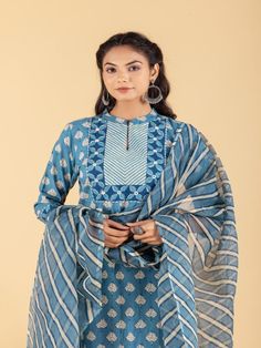 Blue dabu flower printed straight kurta, has a mandarin collar, mirror and katha embroidered yoke, three-quarter sleeves and stripes Print afgani Pants has Elasticated Waistband Fabric: 100% Cotton Color: Blue Note: Available in other colors Wash Care Instruction - Dry Clean Only The product will be shipped within 15-20 days of order placed Size Chart: Kurta Size XS S M L XL XXL XXXL Bust 36 38 40 42 44 46 Waist 32 34 36 38 40 42 Hip 38 40 42 44 46 48 Shoulder 14 14.5 15 15.5 16 16.5 Armhole 18 Indigo Chikankari Embroidery Kurta For Navratri, Indigo Chikankari Kurta For Navratri, Traditional Cotton Silk Anarkali Set For Spring, Bollywood Style Indigo Straight Kurta, Traditional Spring Anarkali Set In Cotton Silk, Indigo Kurta With Chikankari Embroidery For Festivals, Indigo Straight Kurta With Dabka, Indigo Dabka Straight Kurta, Traditional Indigo Kurta With Dabka