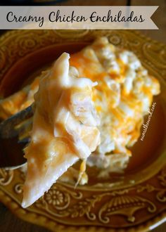 a close up of a plate of food with a fork in it and the words creamy chicken enchiladas