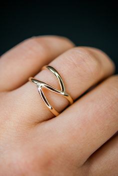 This beautiful 14kt gold-fill wrapped ring will become a staple in your wardrobe. This ring is handcrafted out of a D-shaped (half round) metal. Two ends connect at the center of the ring create a branch-like design. This ring is whimsical, classic and infinitely stylish. Please note, this listing if for ONE single ring in 14K Gold-fill. + Available In Silver (sold separately): https://www.etsy.com/listing/240271360/silver-branch-ring-sterling-silver + View More Stacking Rings: https://www.etsy. Gold Wrap Ring, Criss Cross Ring, Interlocking Ring, Branch Ring, Minimal Ring, Single Ring, Flat Back Earrings, Bold Rings, Gold Wrap