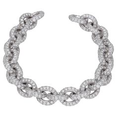 18 kt. white gold chain bracelet with full pave round-cut diamonds. The clasp is embedded with black diamonds to make it easier to open. Round cut diamonds: 30.76 carat ( H-I color / VVS1-VVS2 ) Round-cut black diamonds: 0.25 carat White gold: 61.00 gr. This classic bracelet is Hand-Made in Italy. The bracelet can be customized. Gold Chain Bracelet, White Gold Chain, Classic Bracelets, White Gold Chains, Diamond Chain, Gold Bracelet Chain, Black Diamonds, Round Cut Diamond, Pave Diamonds