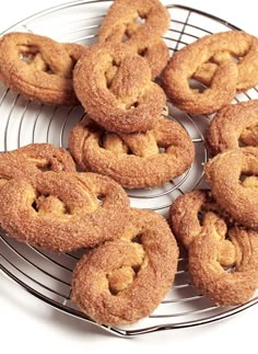 several round pastries on a wire rack