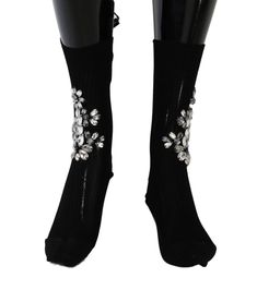 Step into luxury with these exquisite black knitted mid-calf stockings from Dolce & Gabbana. Adorned with clear and gray crystals, these authentic Italian-made socks are a testament to sophisticated style and elevated craftsmanship. Perfect for adding a touch of glamour to any ensemble. Material: 38% Cotton, 62% Viscose Country of origin: IT Color: Black Crystal Socks, Gray Crystals, Crystal Logo, Knit Stockings, Dolce E Gabbana, Ballerina Flats, Dolce & Gabbana, Black Knit, Sophisticated Style