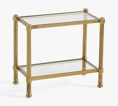 a glass and brass side table with two shelves