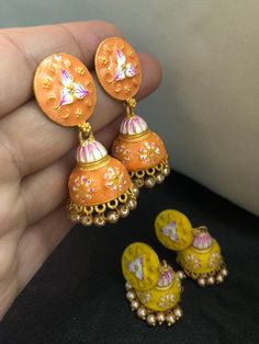 Very stylish and vibrant colors meena work jhumka earrings. Stunningly made designs with all the love and hand painted meena kari, perfect match for a perfect outfit! Grab all the lovely new arrivals we have! Colors : yellow, orange In stock and ready to wear. Handmade Jhumkas As A Gift, Multicolor Chandbalis With Cutdana As A Gift, Handmade Multicolor Round Jhumkas, Handmade Bohemian Kundan Jhumkas, Bohemian Kundan Handmade Jhumkas, Gift Jhumkas With Cutdana For Festivals, Handmade Chandbalis For Festivals And Gifts, Handmade Multicolor Traditional Chandbalis, Traditional Multicolor Handmade Chandbalis