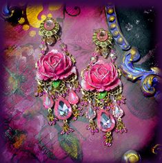 "These Beautiful Crystal Hot Pink Rose Clip-On Chandelier Earrings are are made with Glittery Neon Pink hand-painted resin roses and hand-set Pink Ombre crystal teardrop jewels. These are fairytale earrings! The clip-ons are faced with Pink glass stones atop brass filigrees. Clip-Ons are high-quality, made in the USA and come with plastic cushion sleeves. 3 1/2\" Long x 1 1/2\" Wide -0.4 oz. ea. Metal Finishes Available: Gold (as seen in the images, temporarily sold out) Antique Brass (temporari Rose Chandelier, Pink Chandelier Earrings, Fairytale Earrings, Shabby Chic Earrings, Ornate Jewelry, Hot Pink Roses, Crystal Chandelier Earrings, Painted Resin, Dope Jewelry