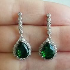 New 925 Silver Filled Pear Cut Emerald Diamond Dangle Drop Earrings For Women All Gemstones Are Simulated. Size Approx 1" Measurements Shown In The Pictures. A Jewelry Box Included. Ready To Ship Same Day. Feel Free To Ask Any Question. All Photos Are Real Time From Actual Object No Stock Photo Used. Color Might Be Slightly Different Due To Lighting. Sterling Silver Pear-shaped Earrings For Party, Elegant 925 Stamped Drop Earrings, Elegant Drop Earrings Stamped 925, Sterling Silver Teardrop Dangle Earrings, Formal Green Teardrop Sterling Silver Earrings, Formal Green Sterling Silver Teardrop Earrings, Silver Teardrop Pendant Earrings, Green Sterling Silver Teardrop Earrings For Formal Occasions, Silver Sterling Silver Teardrop Earrings