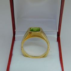 Gemstone: Peridot (from USA) Treatments: Untreated Specifications: 8x8mm, approx. 2.53 carats Color: As shown Clarity: Eye clean Cut: Cushion cut Weight: 16 grams. Ring size: 10, with all sizes available from 6.5 through 12 This is as fine and elegant a man's ring as you will ever find. The perfect blend of a fine gemstone matched up with a clean classic 14K yellow gold ring. Good solid weight, nicely distributed to give the ring an even weight so that it will not spin. There is nothing worse th Classic Gold Ring With Peridot, Formal Rings With Polished Peridot, Green Round Signet Ring With Prong Setting, Formal Peridot Rings With Polished Finish, Green Prong Set Signet Ring For Formal Occasions, Gold Peridot Rings For Formal Occasions, Anniversary Green 14k Stamped Signet Ring, Formal Yellow Gold Peridot Birthstone Ring, Classic Peridot Birthstone Ring For Formal Occasions