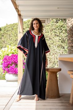 **Note : The kaftan in the video is a different color of the same kaftan and is shown to display the cut, fit, and fabric. You will receive the kaftan in the pictures.** An elegant Moroccan caftan will make you feel like African royalty. It's extremely elegant with a dash of classy cotton embroidery in the front. Ideal for plus size women as well. Made of extremely soft fabric to make you feel free and beautiful at the same time.  This Kaftan is ideal to wear for any casual occasion. Whether tak Traditional Black Maxi Length Thobe, Bohemian Black Thobe For Eid, Traditional Long Black Kaftan, Black Kaftan For Eid, Bohemian Black Embroidered Thobe, Bohemian Embroidered Black Thobe, Traditional Black Kaftan For Vacation, Traditional Black Free Size Kaftan, Bohemian Black Thobe Tunic