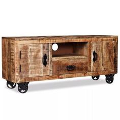 an old wooden entertainment center with wheels