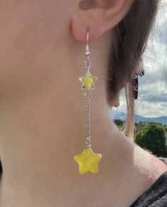 Fun bright addition to your jewelry collection. These shootings star earrings feature 2 stars connected by a chain. They are perfect for any occasion! These earrings are made with 925 silver plated copper, and are hypoallergenic. Star Polymer Clay Earrings, Handmade Yellow Star-shaped Jewelry, Handmade Yellow Star Jewelry, Star Charm Earrings For Jewelry Making, Fun Jewelry Aesthetic, Crazy Earrings, Lantern Earrings, Earring Inspo, Cool Earrings