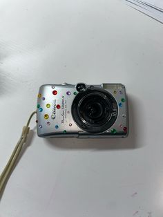 a camera sitting on top of a white table