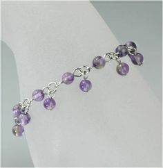 Elegant Natural Stones Charm Bracelet For Gift, Elegant Charm Bracelet With Natural Stones As A Gift, Elegant Natural Stones Charm Bracelet As Gift, Elegant Charm Bracelet With Natural Stones For Gifts, Handmade Lavender Crystal Bracelet Gift, Dainty Handmade Purple Bracelets, Spiritual Gemstone Bracelets As Gift, Handmade Purple Sterling Silver Beaded Bracelets, Elegant Natural Stones Crystal Bracelet Gift