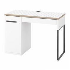 a white desk with a drawer underneath it