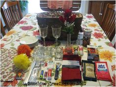 the table is set with wine glasses and other items