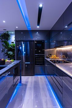 a modern kitchen with stainless steel appliances and blue lighting