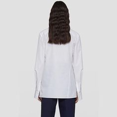 Discover Elegance and Comfort Step into the world of refined fashion with our Asymmetric Cotton Blouse, a perfect blend of style and comfort. Designed for the modern woman, this blouse is a versatile piece that elevates your wardrobe with its understated elegance. Whether you're heading to the office or enjoying a casual day out, this blouse is your go-to choice for a chic, put-together look. Product Features Our blouse boasts a unique asymmetric lapel and a side single-breasted design that adds a contemporary twist to the classic blouse. The solid color pattern, available in timeless white and black, ensures it pairs effortlessly with any outfit. Crafted from a blend of high-quality cotton and polyester, the blouse offers both durability and comfort. Its loose fit design provides a relaxe Luxury Button, Refined Fashion, Button Decorations, Classic Blouses, Unique Blouse, Clothing Catalog, Blouse For Women, Midi Skirts, Stylish Shirt