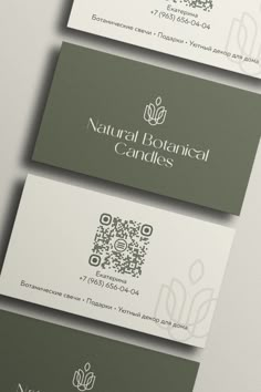 three business cards with the words natural botanical candles printed on them, all in green and white