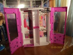 a doll house with pink furniture and accessories in the closet for barbie's dolls