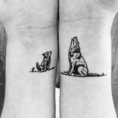 two small tattoos on the wrist of people, one with a wolf and another with a dog