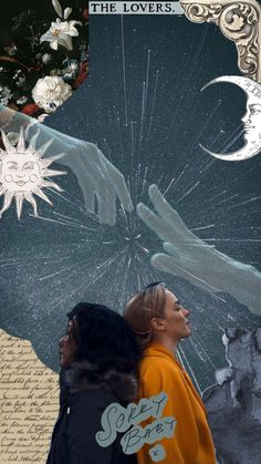 two people standing next to each other in front of a painting with the sun and moon on it