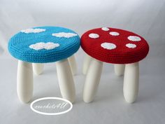 two knitted stools sitting next to each other on top of white bases with red and blue dots