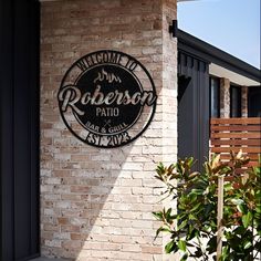 a brick building with a sign on the side of it that says robinson patio and grill