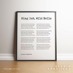 a framed poster with the words ring out, wild bells in black and white on it