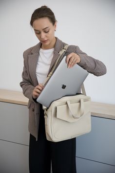 Introducing our women's leather laptop bag, the perfect blend of style and functionality. Designed specifically for women, this laptop tote bag is crafted from luxurious leather, allowing you to carry your laptop in utmost elegance.  Whether you're heading to the office or a business meeting, this leather laptop bag is a must-have accessory that combines practicality with timeless sophistication. Upgrade your professional look with our women's leather laptop bag today. Optionally, you can make c Luxury Briefcase For Business, Luxury Leather Briefcase For Gift, Everyday Laptop Bag With Adjustable Strap And Double Handle, Trendy Office Laptop Bag With Sleeve, Trendy Business Laptop Bag With Sleeve, Everyday Laptop Shoulder Bag With Adjustable Strap, Minimalist Leather Laptop Bag With Removable Pouch, Trendy Laptop Bag For Travel, Beige Double Handle Laptop Bag For Travel