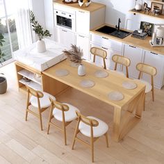 a kitchen table with six chairs around it in front of an oven and counter top