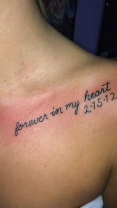 a woman with a tattoo on her shoulder that says, i forever in my heart